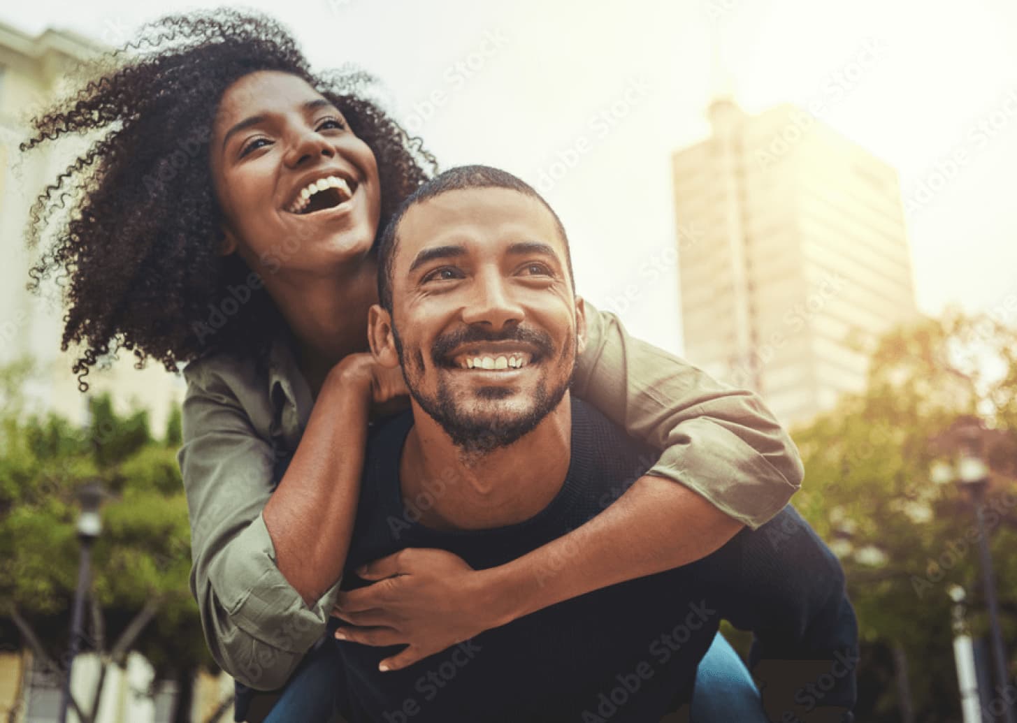 Couple laughing together with healthy gums and teeth
